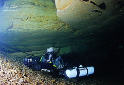 diver on the way out from the Cave by Andy Kutsch 
